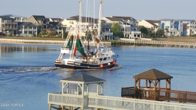 This lovely 3 bedroom 3 bathroom waterfront home was built in on Brick Landing Plantation Yacht and Golf Club in North Carolina - for sale on GolfHomes.com, golf home, golf lot