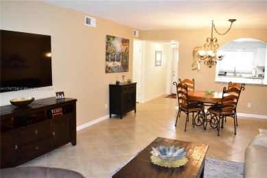 This large ground floor 2/2 is tastefully done and meticulously on Sunrise Lakes Phase IV Golf Course in Florida - for sale on GolfHomes.com, golf home, golf lot