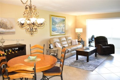 This large ground floor 2/2 is tastefully done and meticulously on Sunrise Lakes Phase IV Golf Course in Florida - for sale on GolfHomes.com, golf home, golf lot