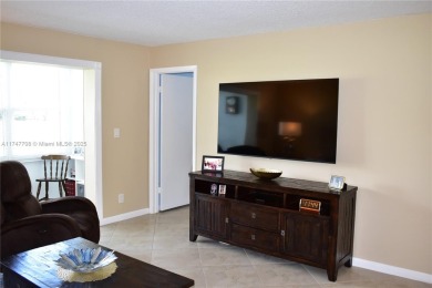 This large ground floor 2/2 is tastefully done and meticulously on Sunrise Lakes Phase IV Golf Course in Florida - for sale on GolfHomes.com, golf home, golf lot