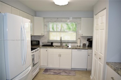 This large ground floor 2/2 is tastefully done and meticulously on Sunrise Lakes Phase IV Golf Course in Florida - for sale on GolfHomes.com, golf home, golf lot