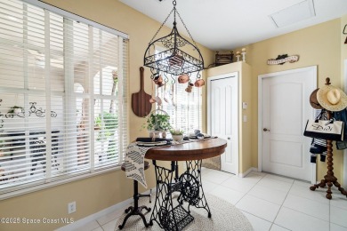 Enjoy stunning water views and abundant natural light in this on Viera East Golf Club in Florida - for sale on GolfHomes.com, golf home, golf lot