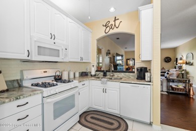 Enjoy stunning water views and abundant natural light in this on Viera East Golf Club in Florida - for sale on GolfHomes.com, golf home, golf lot