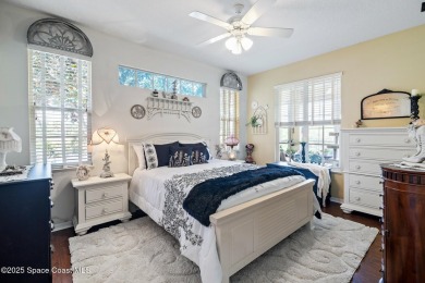 Enjoy stunning water views and abundant natural light in this on Viera East Golf Club in Florida - for sale on GolfHomes.com, golf home, golf lot
