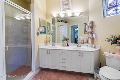 Enjoy stunning water views and abundant natural light in this on Viera East Golf Club in Florida - for sale on GolfHomes.com, golf home, golf lot