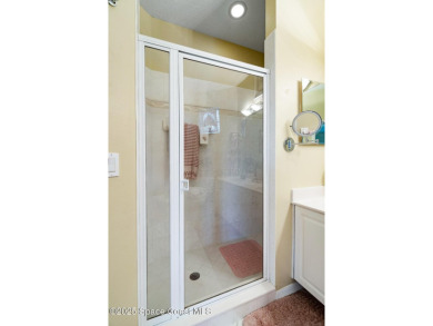 Enjoy stunning water views and abundant natural light in this on Viera East Golf Club in Florida - for sale on GolfHomes.com, golf home, golf lot