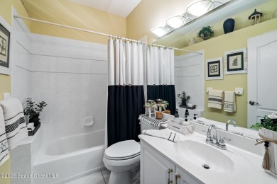 Enjoy stunning water views and abundant natural light in this on Viera East Golf Club in Florida - for sale on GolfHomes.com, golf home, golf lot