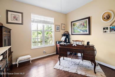 Enjoy stunning water views and abundant natural light in this on Viera East Golf Club in Florida - for sale on GolfHomes.com, golf home, golf lot