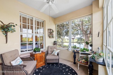 Enjoy stunning water views and abundant natural light in this on Viera East Golf Club in Florida - for sale on GolfHomes.com, golf home, golf lot
