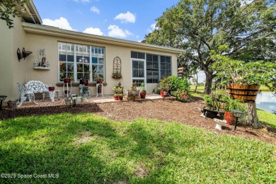 Enjoy stunning water views and abundant natural light in this on Viera East Golf Club in Florida - for sale on GolfHomes.com, golf home, golf lot