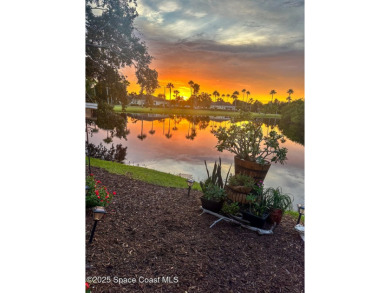 Enjoy stunning water views and abundant natural light in this on Viera East Golf Club in Florida - for sale on GolfHomes.com, golf home, golf lot