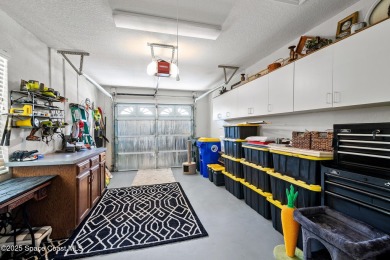 Enjoy stunning water views and abundant natural light in this on Viera East Golf Club in Florida - for sale on GolfHomes.com, golf home, golf lot