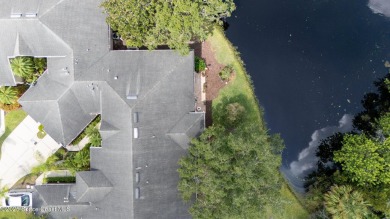 Enjoy stunning water views and abundant natural light in this on Viera East Golf Club in Florida - for sale on GolfHomes.com, golf home, golf lot