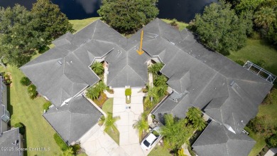 Enjoy stunning water views and abundant natural light in this on Viera East Golf Club in Florida - for sale on GolfHomes.com, golf home, golf lot