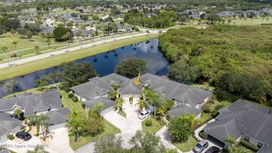 Enjoy stunning water views and abundant natural light in this on Viera East Golf Club in Florida - for sale on GolfHomes.com, golf home, golf lot