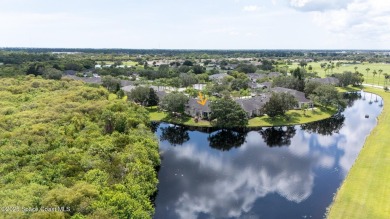 Enjoy stunning water views and abundant natural light in this on Viera East Golf Club in Florida - for sale on GolfHomes.com, golf home, golf lot