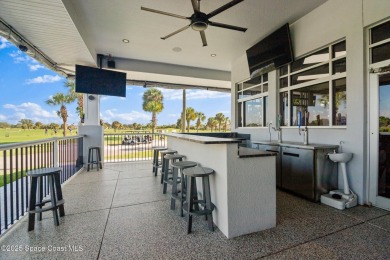 Enjoy stunning water views and abundant natural light in this on Viera East Golf Club in Florida - for sale on GolfHomes.com, golf home, golf lot