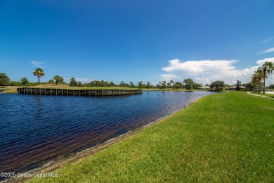 Enjoy stunning water views and abundant natural light in this on Viera East Golf Club in Florida - for sale on GolfHomes.com, golf home, golf lot