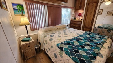 TWO BEDROOM, ONE BATH MOBILE HOME IN ACTIVE 55+ COMMUNITY! This on River Run Golf Links in Florida - for sale on GolfHomes.com, golf home, golf lot