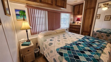 TWO BEDROOM, ONE BATH MOBILE HOME IN ACTIVE 55+ COMMUNITY! This on River Run Golf Links in Florida - for sale on GolfHomes.com, golf home, golf lot