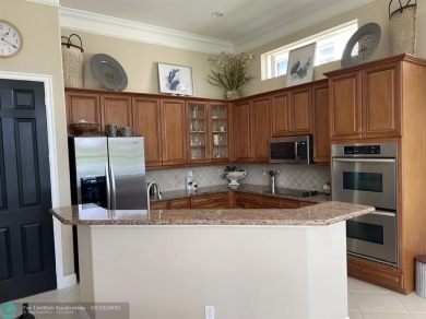 Over $100k of Updates, Impact Glass Windows on the front and on Heron Bay Golf Club in Florida - for sale on GolfHomes.com, golf home, golf lot