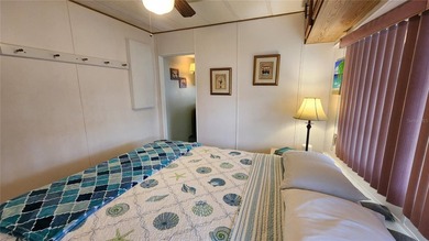 TWO BEDROOM, ONE BATH MOBILE HOME IN ACTIVE 55+ COMMUNITY! This on River Run Golf Links in Florida - for sale on GolfHomes.com, golf home, golf lot