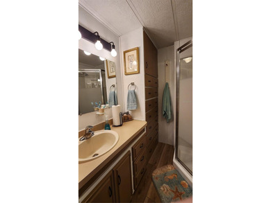 TWO BEDROOM, ONE BATH MOBILE HOME IN ACTIVE 55+ COMMUNITY! This on River Run Golf Links in Florida - for sale on GolfHomes.com, golf home, golf lot