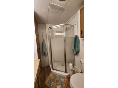 TWO BEDROOM, ONE BATH MOBILE HOME IN ACTIVE 55+ COMMUNITY! This on River Run Golf Links in Florida - for sale on GolfHomes.com, golf home, golf lot