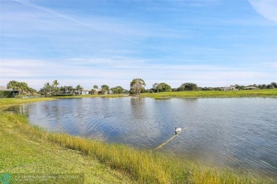 Over $100k of Updates, Impact Glass Windows on the front and on Heron Bay Golf Club in Florida - for sale on GolfHomes.com, golf home, golf lot