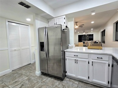 Enjoy Florida's lifestyle at its best in this renovated top on Countryside Country Club in Florida - for sale on GolfHomes.com, golf home, golf lot