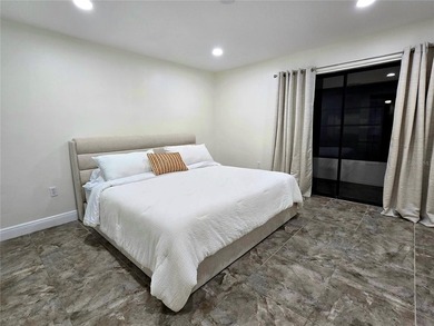 Enjoy Florida's lifestyle at its best in this renovated top on Countryside Country Club in Florida - for sale on GolfHomes.com, golf home, golf lot