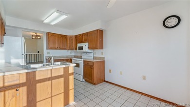 Tastefully updated and beautifully decorated condo at the on Seasons Ridge At Four Seasons in Missouri - for sale on GolfHomes.com, golf home, golf lot