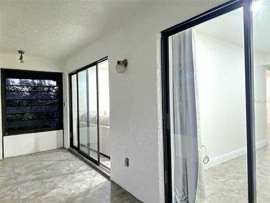 Enjoy Florida's lifestyle at its best in this renovated top on Countryside Country Club in Florida - for sale on GolfHomes.com, golf home, golf lot