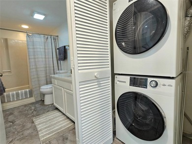 Enjoy Florida's lifestyle at its best in this renovated top on Countryside Country Club in Florida - for sale on GolfHomes.com, golf home, golf lot