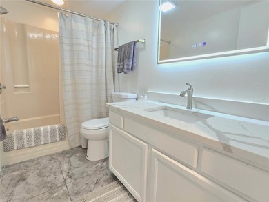 Enjoy Florida's lifestyle at its best in this renovated top on Countryside Country Club in Florida - for sale on GolfHomes.com, golf home, golf lot