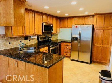 This golf course home is located on the 2nd hole in a gated on Upland Hills Country Club in California - for sale on GolfHomes.com, golf home, golf lot