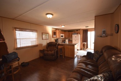 Two-bedroom one bath located on Roy Lake. 1991 14 x 50 mobile on Roy View Golf Course in South Dakota - for sale on GolfHomes.com, golf home, golf lot