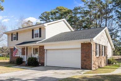 Welcome home! This spacious 4-bedroom 2.5 bathroom beauty is on Jacksonville Country Club in North Carolina - for sale on GolfHomes.com, golf home, golf lot