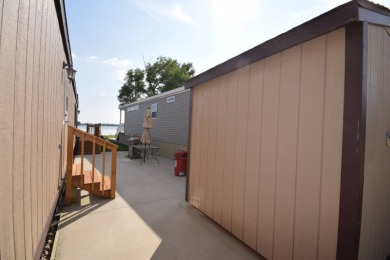 Two-bedroom one bath located on Roy Lake. 1991 14 x 50 mobile on Roy View Golf Course in South Dakota - for sale on GolfHomes.com, golf home, golf lot