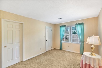 This traditional 4-bedroom, 3-bathroom home overlooks the 2nd on Cobbs Glen Country Club in South Carolina - for sale on GolfHomes.com, golf home, golf lot