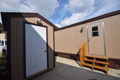 Two-bedroom one bath located on Roy Lake. 1991 14 x 50 mobile on Roy View Golf Course in South Dakota - for sale on GolfHomes.com, golf home, golf lot