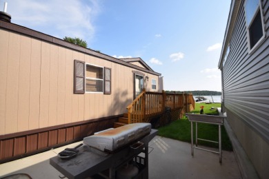 Two-bedroom one bath located on Roy Lake. 1991 14 x 50 mobile on Roy View Golf Course in South Dakota - for sale on GolfHomes.com, golf home, golf lot