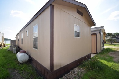 Two-bedroom one bath located on Roy Lake. 1991 14 x 50 mobile on Roy View Golf Course in South Dakota - for sale on GolfHomes.com, golf home, golf lot