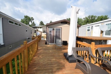 Two-bedroom one bath located on Roy Lake. 1991 14 x 50 mobile on Roy View Golf Course in South Dakota - for sale on GolfHomes.com, golf home, golf lot