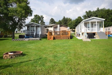 Two-bedroom one bath located on Roy Lake. 1991 14 x 50 mobile on Roy View Golf Course in South Dakota - for sale on GolfHomes.com, golf home, golf lot