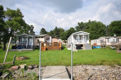 Two-bedroom one bath located on Roy Lake. 1991 14 x 50 mobile on Roy View Golf Course in South Dakota - for sale on GolfHomes.com, golf home, golf lot