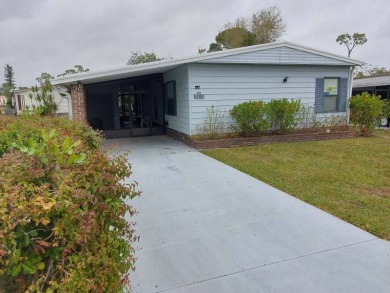 Lot Rent is $1,185.00 monthly. This is a 2-bedroom 2 bath on Lake Fairways Country Club in Florida - for sale on GolfHomes.com, golf home, golf lot