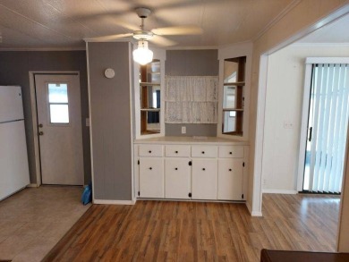 Lot Rent is $1,185.00 monthly. This is a 2-bedroom 2 bath on Lake Fairways Country Club in Florida - for sale on GolfHomes.com, golf home, golf lot