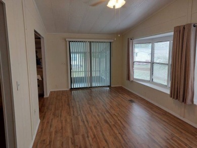 Lot Rent is $1,185.00 monthly. This is a 2-bedroom 2 bath on Lake Fairways Country Club in Florida - for sale on GolfHomes.com, golf home, golf lot