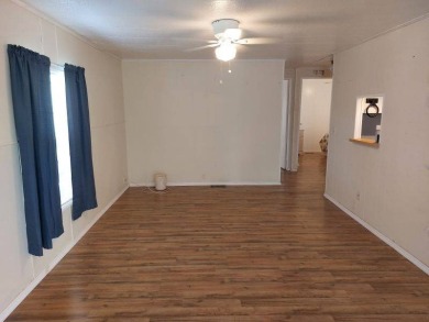 Lot Rent is $1,185.00 monthly. This is a 2-bedroom 2 bath on Lake Fairways Country Club in Florida - for sale on GolfHomes.com, golf home, golf lot